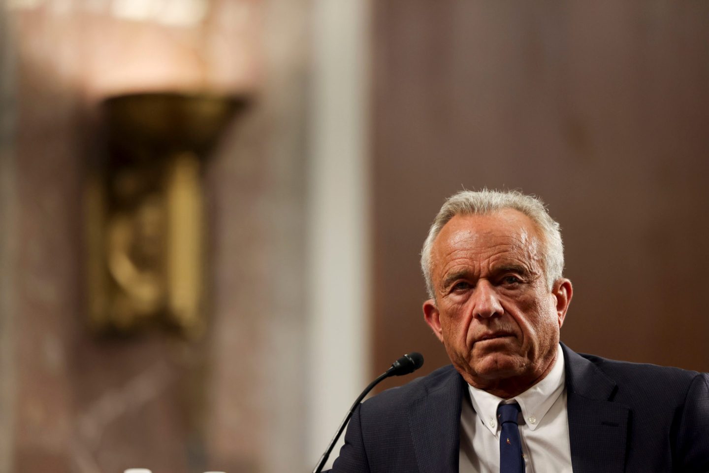 RFK Jr. sits in a confirmation hearing