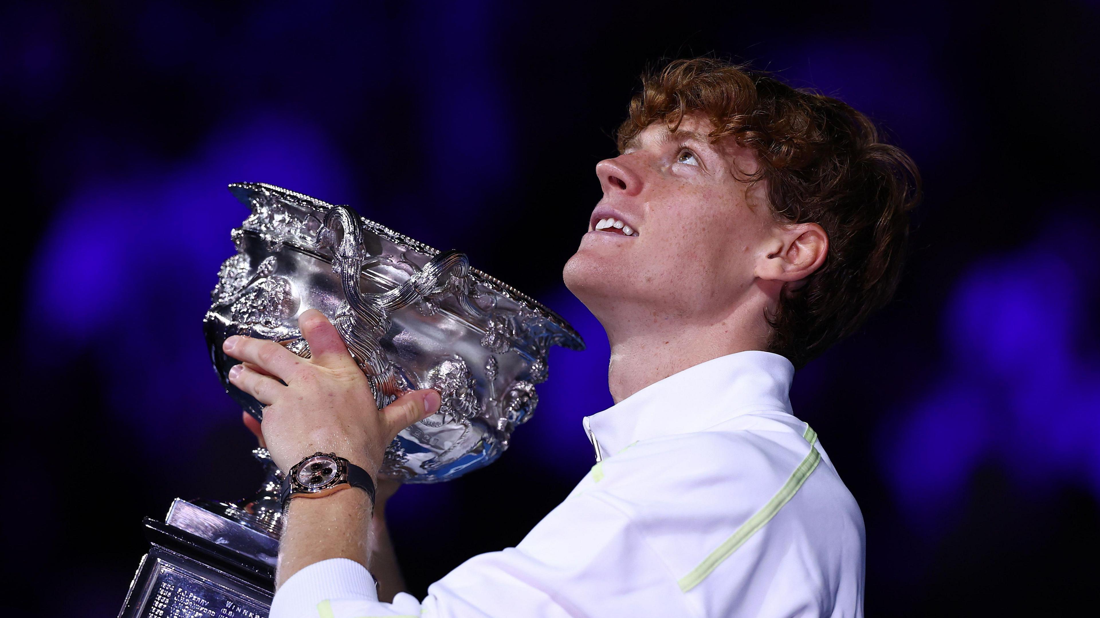 Jannik Sinner lifts the Australian Open trophy 