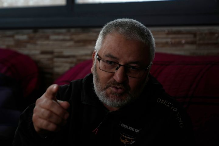 Mohammed Shula speaks at a relative's house, where he and his wife have taken refuge, in the West Bank village of Kafr al-Labad, on Monday, Feb. 10, 2025.