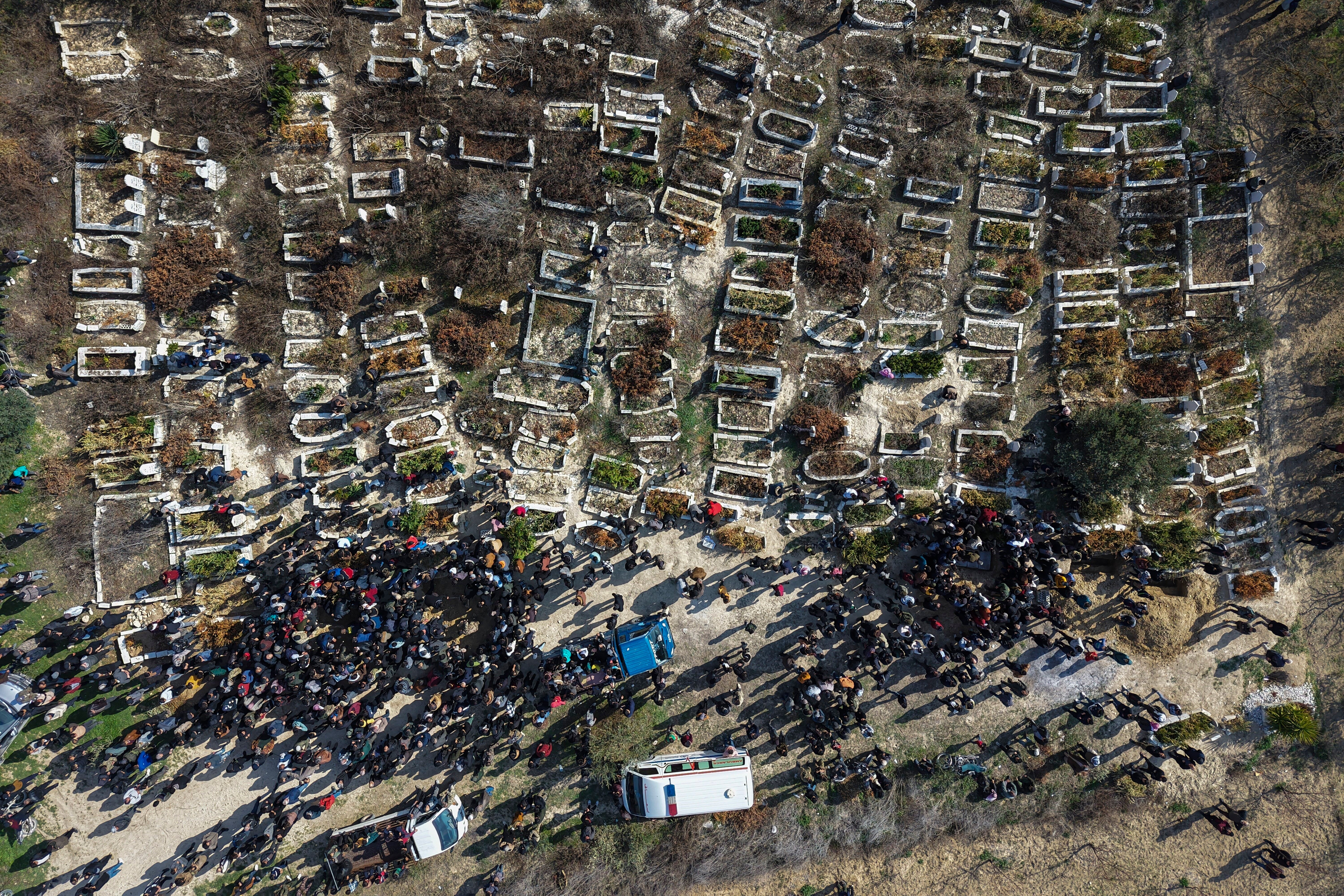 Relatives and neighbours attend the funeral procession for four Syrian security force members killed in clashes with loyalists of ousted President Bashar Assad in coastal Syria, in the village of Al-Janoudiya, west of Idlib, Saturday, March 8, 2025. (AP Photo/Omar Albam)