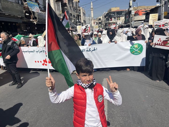 A child holding a Palestinian flag joins protesters in Amman, Jordan, who are marching against U.S. President Donald Trump's plan to forcibly displace Palestinians in the occupied West Bank and Gaza, on Feb. 28, 2025.