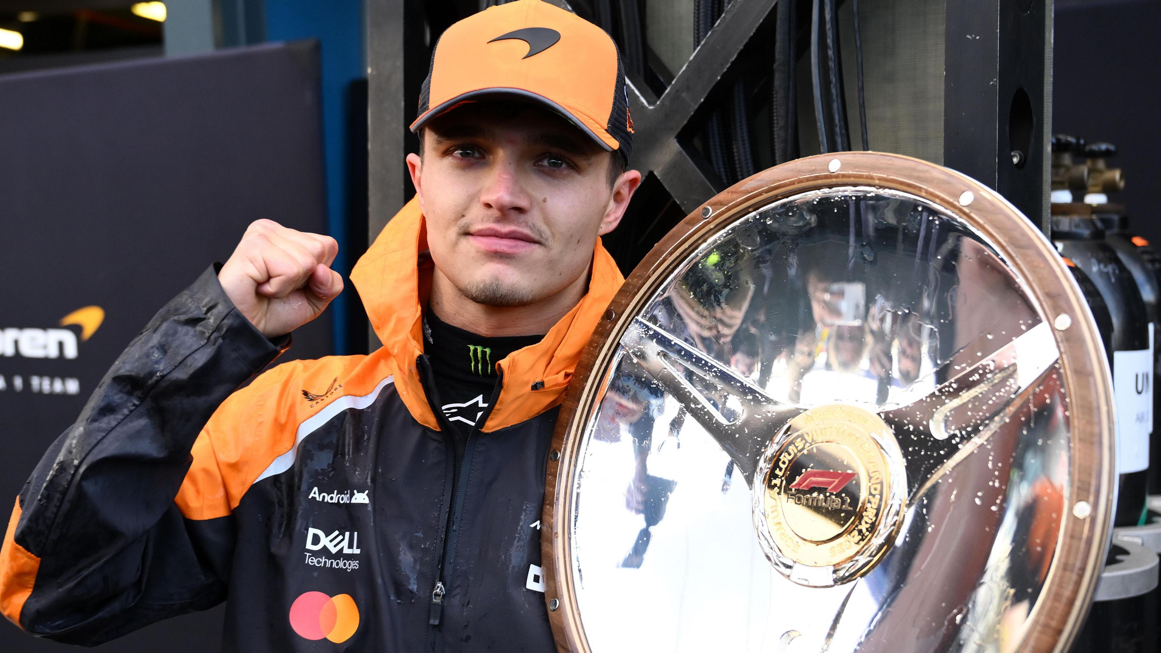 McLaren's Lando Norris holds the winner's trophy for the Australian Grand Prix