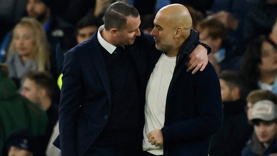 Nicky Hayen and Pep Guardiola embrace