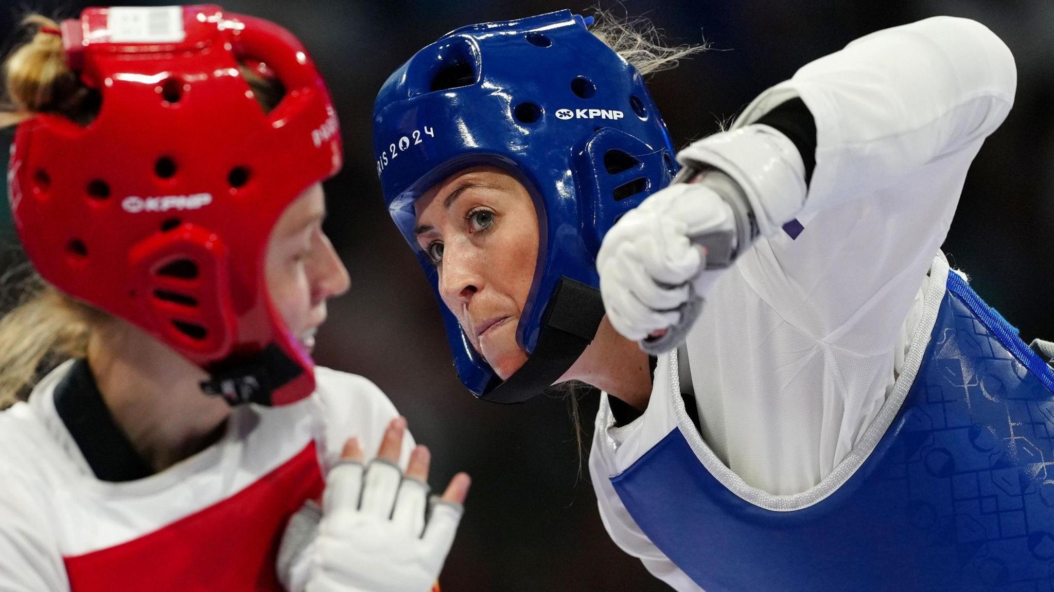 Jade Jones aims a blow at Miljana Reljikj of Macedonia in the women's Taekwondo at the Paris Olympics in 2024