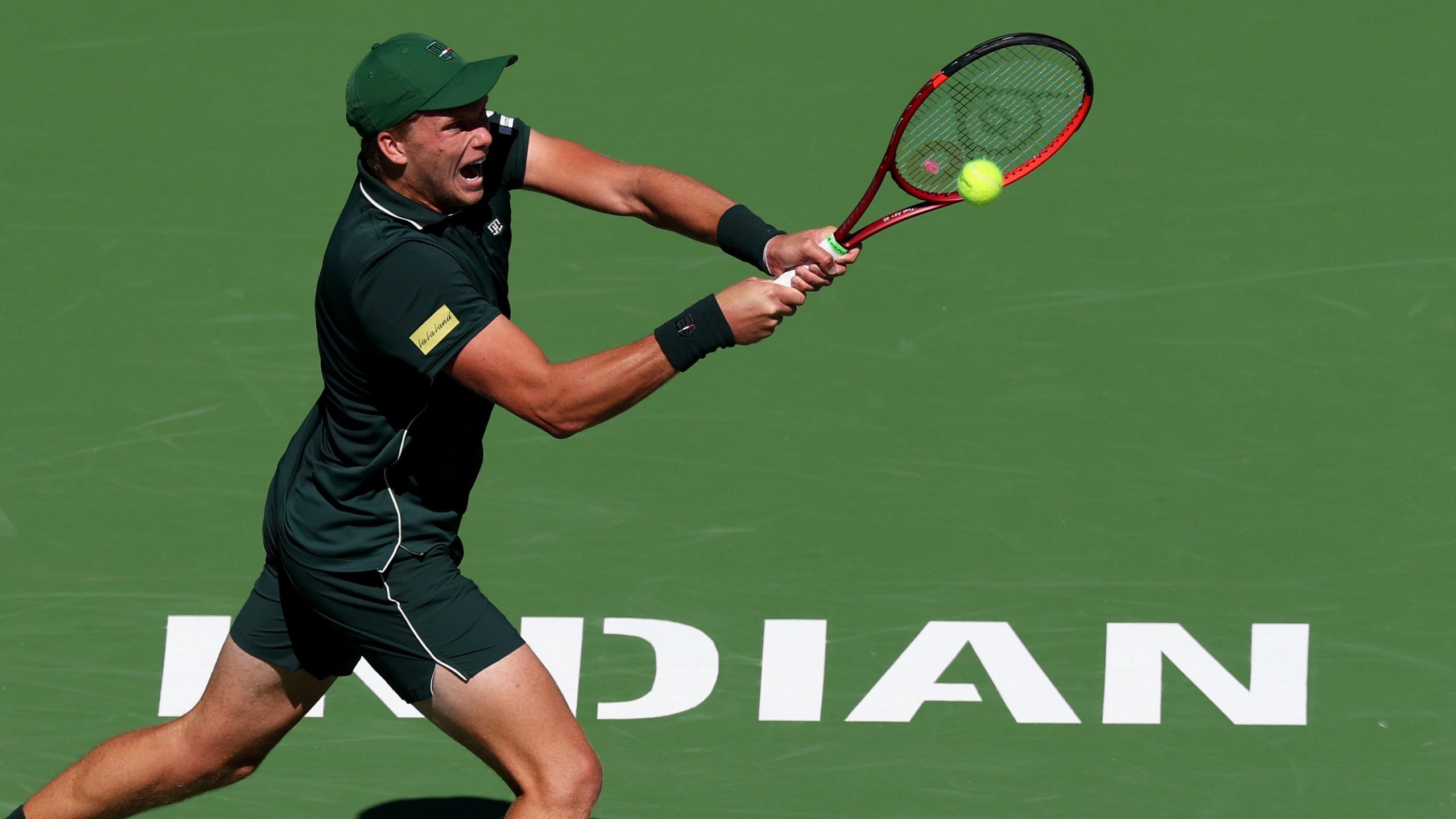 Jenson Brooksby hits a shot at Indian Wells