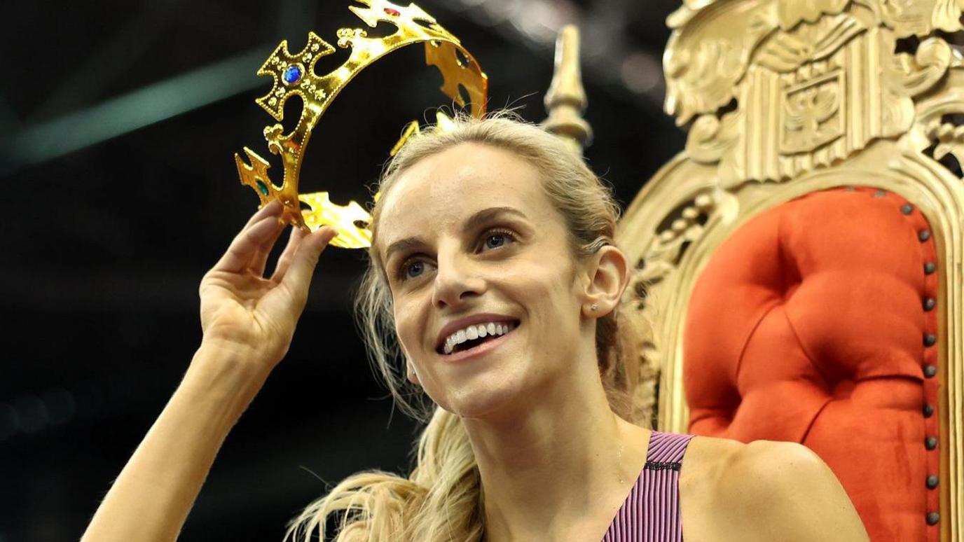 Georgia Hunter Bell receives a crown and sits on a throne after winning the 1500m at the Keely Klassic