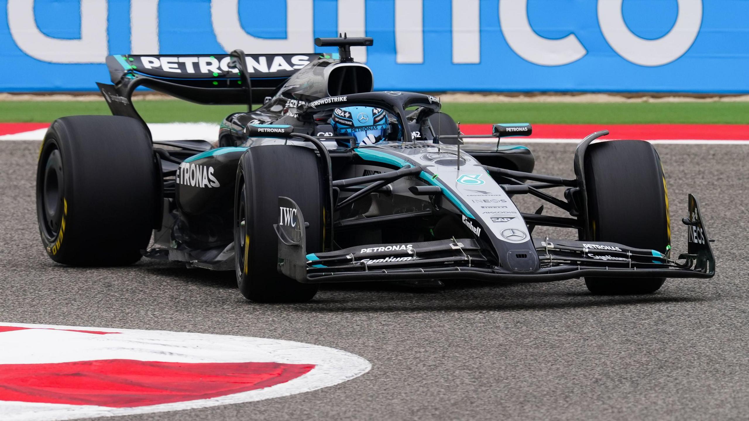 George Russell steers his Mercedes around a corner during pre-season testing in Bahrain