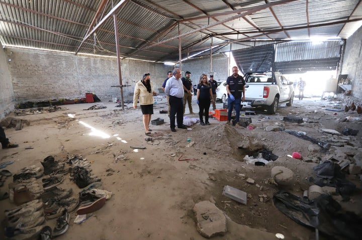 Investigators are seen inspecting the Izaguirre Ranch on Tuesday where skeletal remains were discovered.