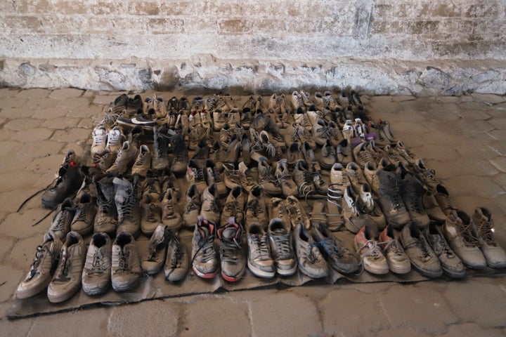 Shoes are seen Tuesday at the Izaguirre Ranch where skeletal remains were discovered. The remote ranch outside Mexico's second-largest city, Jalisco, was allegedly being used as a training base for cartel recruits.