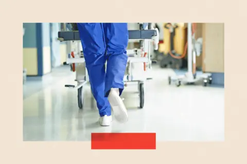 Getty Images A shot of the legs of a medic running with hospital bed along a hospital corridor