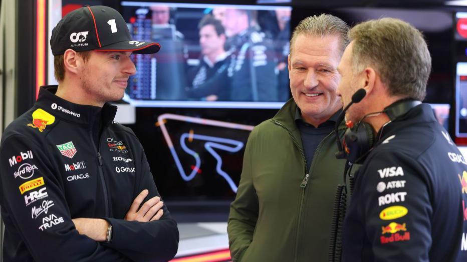 Max Verstappen, his dad Jos and Red Bull team boss Christian Horner in conversation during 2025 pre-season testing in Bahrain